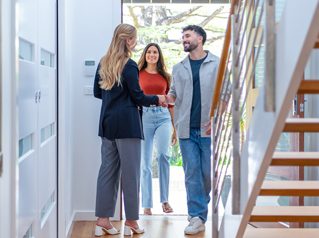 Couple entering new home