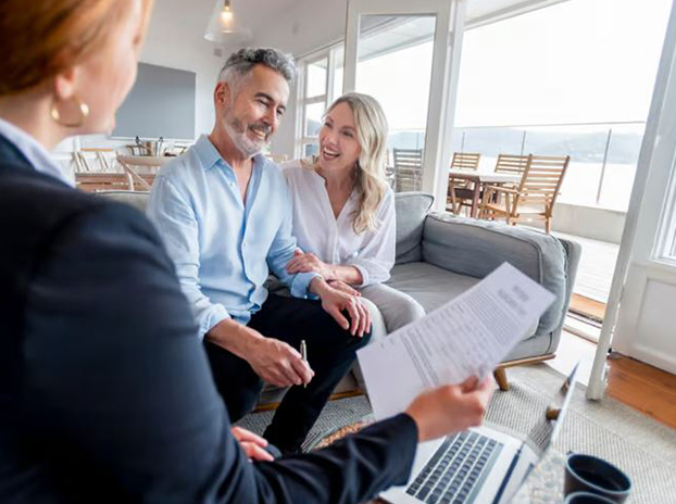 Couple discussing assets with agent